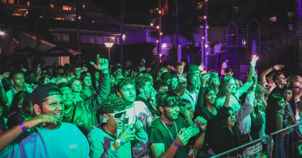 Crowd washed in green stage light
